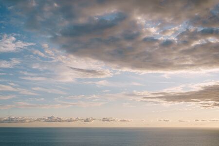 Blue sunset sky with clouds over the horizon over the Adriatic Seaの写真素材