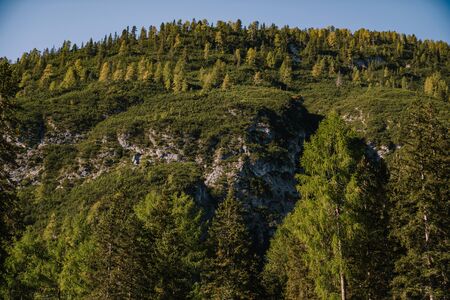 Rocky Mountains with green forests on Lago di Braies. Braies lake in the Dolomites in South Tyrol, Italy, Briesmunicipality Municipality, in the Valley of Prague.の写真素材