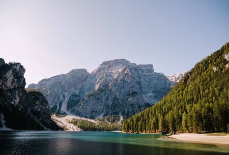 Rocky mountains with green forests at Lago di Braies. Braies lake in the Dolomites in South Tyrol, Italy, a municipality of Braies, in the Prague Valley.の写真素材