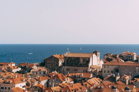 Facade of the church of Saint Ignatius in Dubrovnik, Croatia. Statue of an angel above the entrance to the church.の写真素材