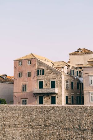 Facades of residential buildings behind the wall in the old city of Dubrovnik, Croatia.の写真素材