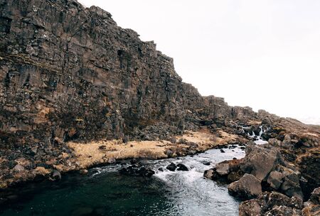 Mountain river from Ehsaraurfoss Falls, in Silfra Fault, Tingwedlir Valley.の写真素材