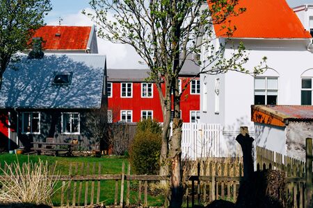 Backyard of traditional houses in Reykjavik, the capital of Iceland. White, black and red at home.