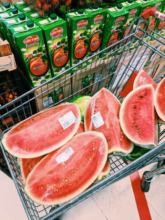 Budva, Montenegro - 10 june 2020: Watermelon quarters are in the shopping cart.のeditorial素材