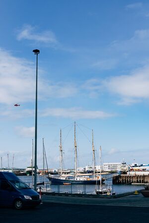 Sailing wooden ship with three masts moored in the port of Reykjavik, in the capital of Iceland.