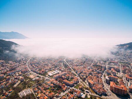 White fog is coming from the sea to the city of Budva in Montenegro.の写真素材