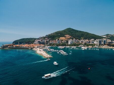 Boat dock and yacht port in Budva, Montenegro. Aerial photo from the drone.