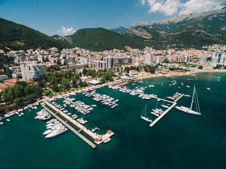 Boat dock and yacht port in Budva, Montenegro. Aerial photo from the drone.