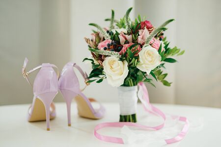 bridal bouquet of white and pink roses, boxwood branches, aronia, veronica flowers, pink and white...