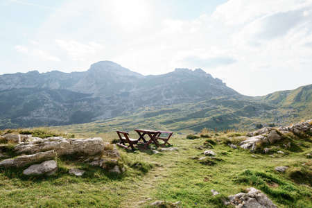 A wooden bench in the mountains of Montenegro in Durmitor National Park, Sedlo Pass.の写真素材