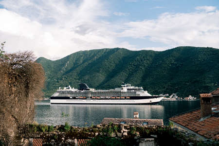 Cruise liner in the Kotor Bay in Montenegro. The liner is sailing near the town of Perast.
