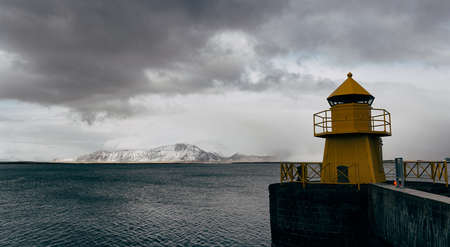 A large yellow lighthouse in Iceland, Reykjavik.の写真素材