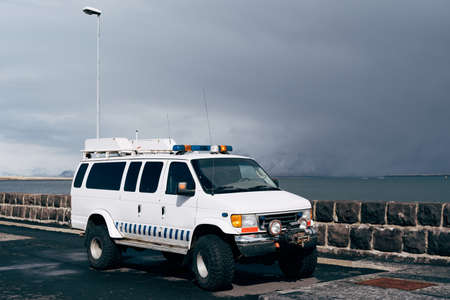 Reykjavik, Iceland - 02 may 2019: A white Ford Econoline van on huge wheels, with sirens and flashing lights, parked on the waterfront in Reykjavik, Iceland.のeditorial素材