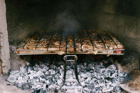 Lamb ribs are fried on coals on the grill.の写真素材