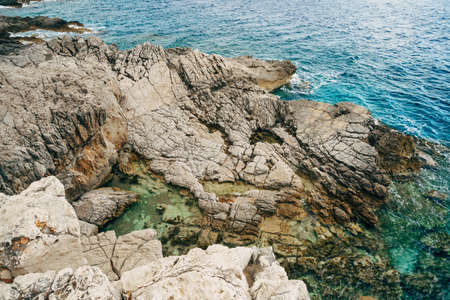Wild beach on the rocks, Adriatic coast in Montenegro.の写真素材