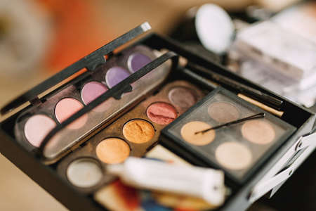 Makeup artist set. Close-up of a palette of eyeshadows in different colors.の写真素材