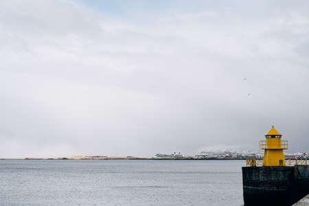 A large yellow lighthouse in Iceland, Reykjavik.の写真素材