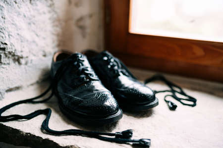 Black Scottish Groom Shoes with Rabbit Leather Long Laces - Ghillie Brogues.の写真素材