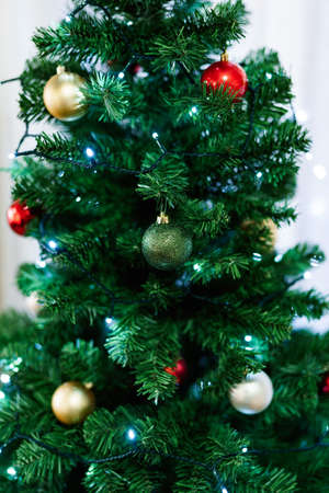 Christmas background - baubles and branch of spruce treeの写真素材
