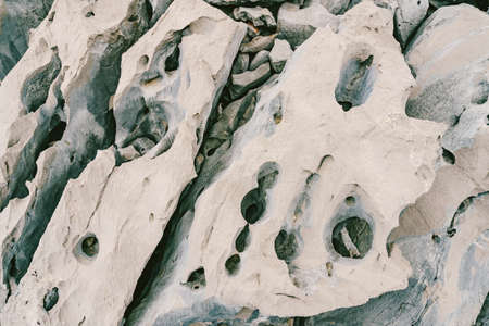 Sharp rocks with voids and holes on the Adriatic coast in Montenegro.