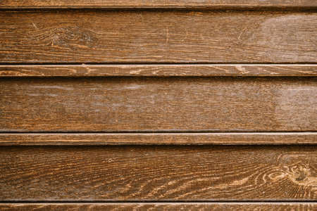 Texture of an old brown board close-up.