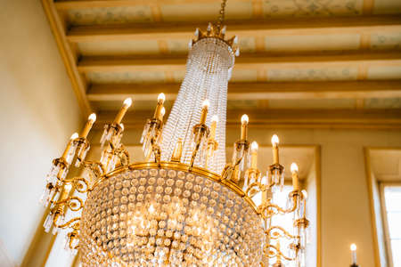 Antique large crystal chandelier with pendants and candles.の写真素材