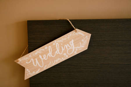 Wedding sign hanging on a wooden headboardの写真素材
