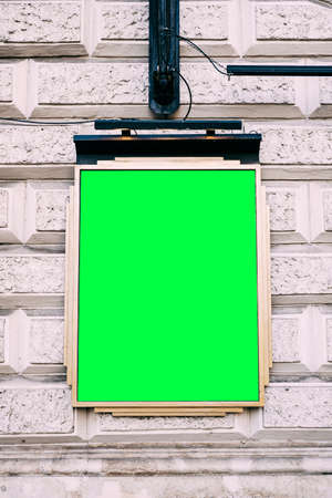 Plaque with blank background hanging on brick buildingの写真素材