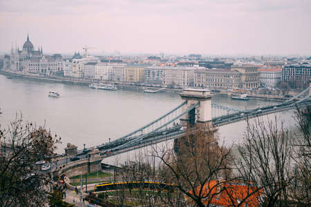 Panoramic daytime view of the Szechenyi Chain Bridge and the ensemble of buildings along the waterfront in Budapestの写真素材