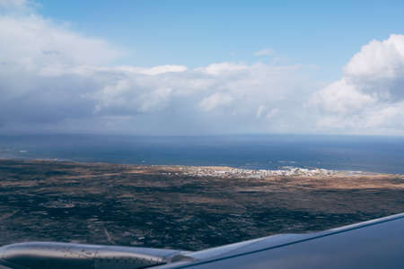 View of the rugged landscape of Iceland from the airplane windowの写真素材