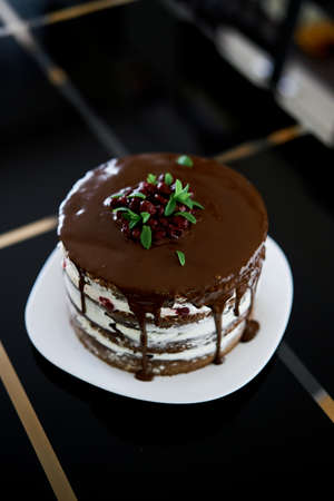 Chocolate brownie cake with cherries and cream cheese on a table. Top viewの写真素材