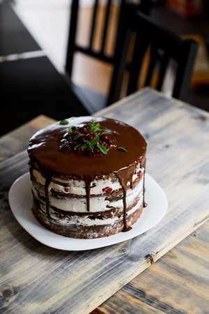 Chocolate brownie cake with dark chocolate on a tableの写真素材