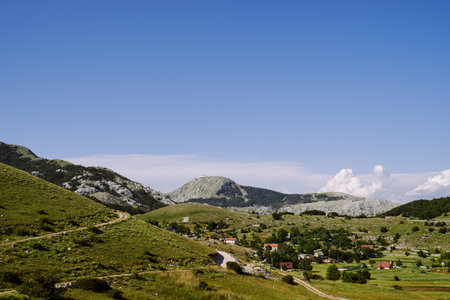 Panorama of a mountain village among greeneryの写真素材