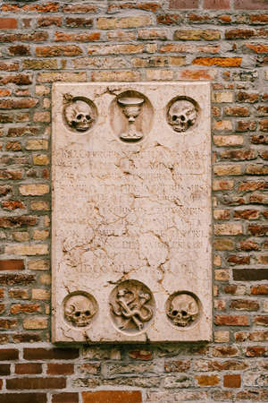 Graveyard inscription on church. Munich, Germany
