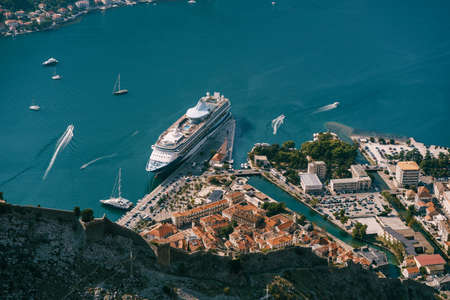 Cruise ship at the pier of the old town of Kotor. View from Mount Lovcenの写真素材