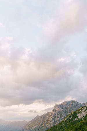 Mount Lovcen against the background of pink clouds. Montenegro