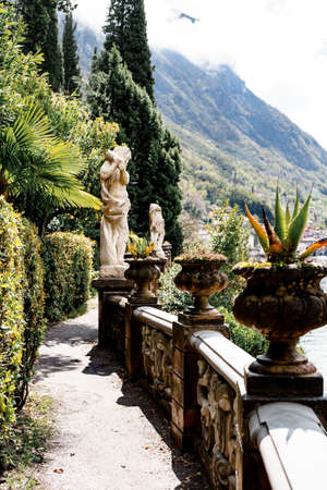 Alley with balustrades and statues near Villa Monastero. Lake Como, Italyの写真素材