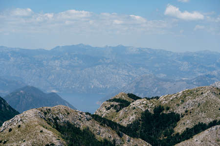 Mountain range around the Bay of Kotor in the fog. Montenegro
