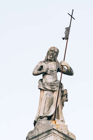 Sculpture of a man with a cross on the Church of Saint apostle Mark. Montenegroの写真素材