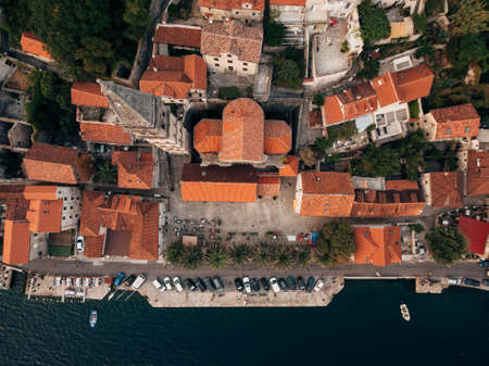 Top view of the bell tower among the old houses in Perast. Montenegroの写真素材
