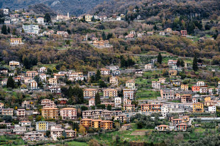 Colorful houses of the town of Varenna surrounded by mountains. Como. Italyの写真素材
