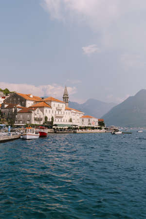 Perast buildings against the background of mountains in the haze. Montenegroの写真素材