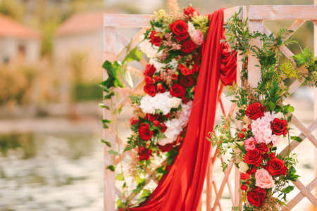 Wooden folding wedding screen decorated with flowers and draperyの写真素材