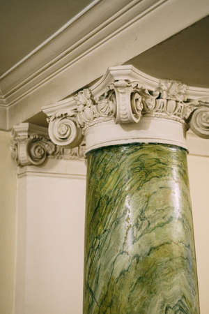Fragment of a marble column with stucco molding on topの写真素材