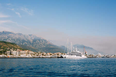 Luxury three-deck superyacht moored off the coast of Porto