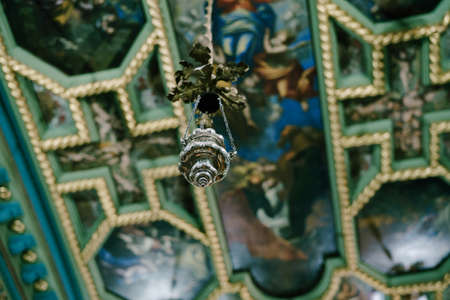Censer decorated with oak leaves hangs from the ceiling of the Church of Our Lady of the Rocksの写真素材