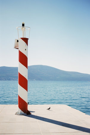 Solar powered automatic lighthouse at the pier in Porto. Montenegroの写真素材