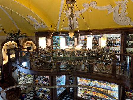 Budva, Montenegro - 01.08.22: Large carved ceiling chandelier in a grocery storeのeditorial素材