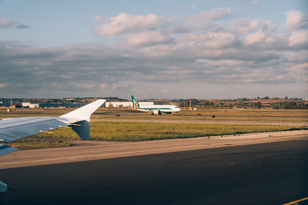 Florence, Italy - 25.04.2021: An airport with a plane on the foreground.のeditorial素材