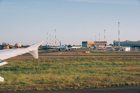 Florence, Italy - 25.04.2021: An airport with a plane on the foreground.のeditorial素材